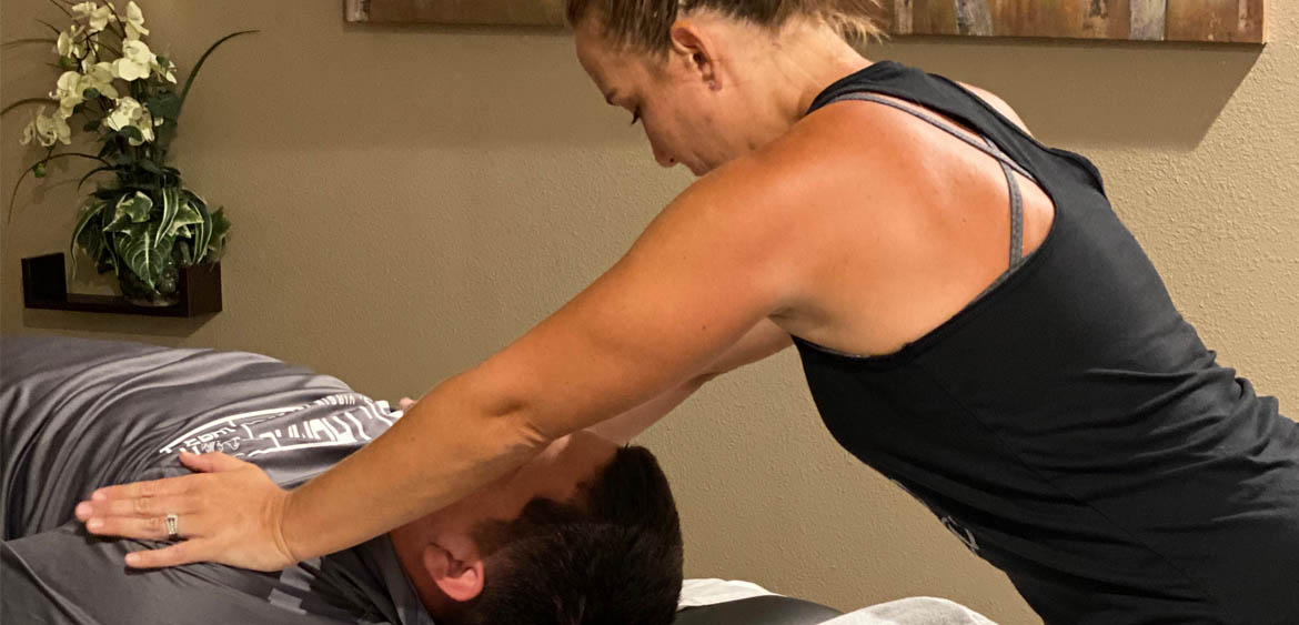 therapist performing passive stretching on client